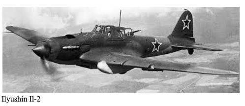 Black and white photo of a Soviet Ilyushin Il-2 aeroplane in flight, featuring red star insignia on the wings and tail.
