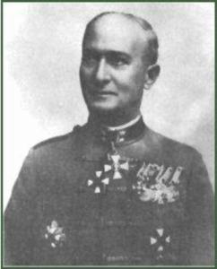 Black and white portrait of a man in a decorated military uniform with several medals and insignia on his chest, looking slightly to the side.