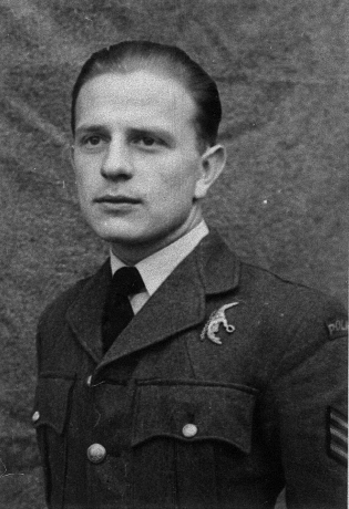 A young man in a military uniform poses for a formal portrait against a plain background.