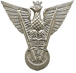 Silver emblem of an eagle with outstretched wings, a crown, and a shield with the word "Honour" at the centre, featuring two crossed rifles below.