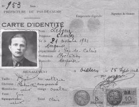Black and white French identity card with a photo of a man, official stamps, handwritten information, and two postage stamps.