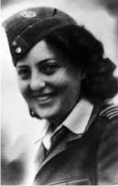 A woman in a military uniform with a cap smiles at the camera in a black and white photograph.
