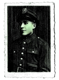 Black and white portrait of a uniformed soldier wearing a cap, facing slightly to the side. The photo has a decorative, worn border.