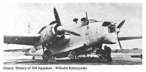 A black and white photo of a Second World War-era military aeroplane, parked on a runway with its crew working around it.