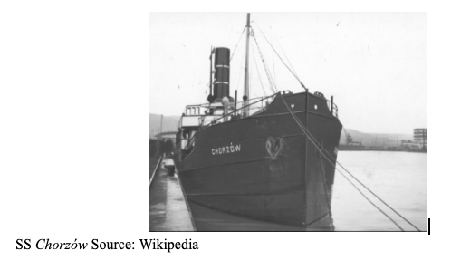 Black-and-white photo of the SS Chorzów docked at a quay, viewed from the front with its name visible on the bow.