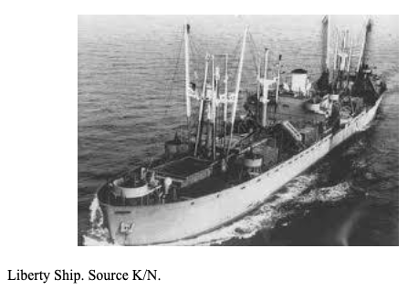 A black and white photo of a Liberty Ship sailing on the ocean, with visible cargo cranes and an open deck.