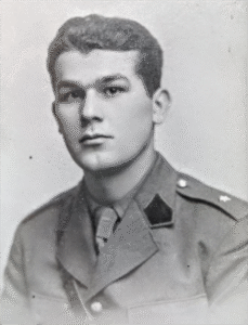 Black-and-white portrait of a young man in a military uniform, facing forwards with a neutral expression.