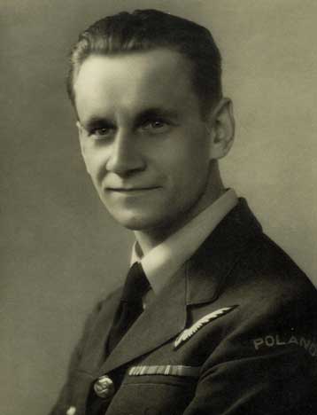 Black and white portrait of a man in a military uniform with "Poland" on the sleeve, looking at the camera with a neutral expression.