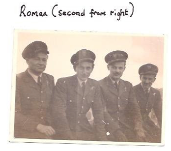 Four men in uniform pose for a photo; handwritten text above identifies "Roman" as the second person from the right.
