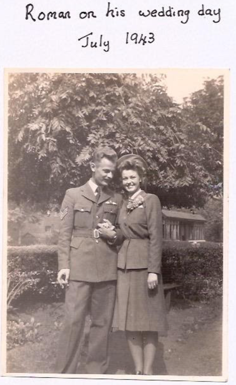 A man in military uniform and a woman in a suit stand together outdoors, smiling and holding hands. Handwritten text above reads: "Roman on his wedding day July 1943.