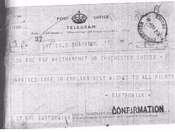 Black-and-white telegram stating: "Arrived safely in England. Best wishes to all pilots. Bartkowiak." Stamped with "Confirmation.